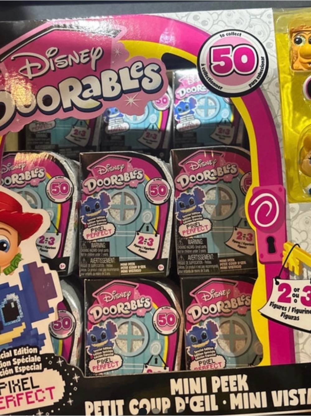 Disney Doorables Mini Peek Collectible Toy - Pink and Yellow Packaging